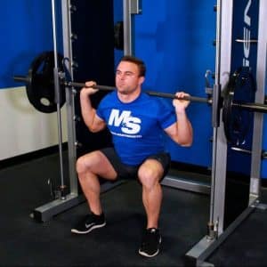 squat guidé à la smith machine